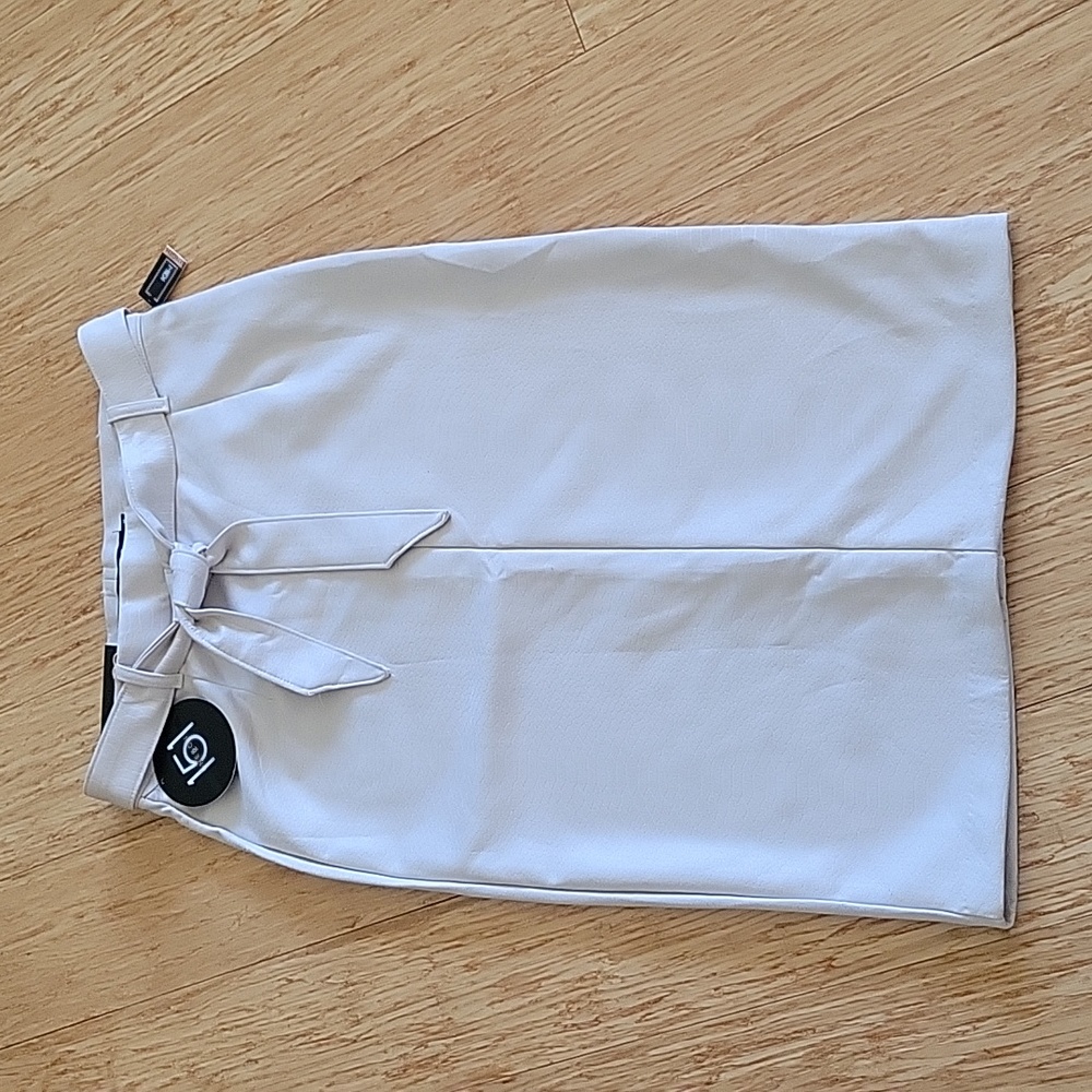 Cream faux suede skirt by One 5 One.